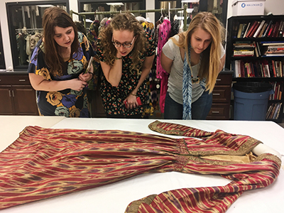 Researchers examining a TFC exhibit.