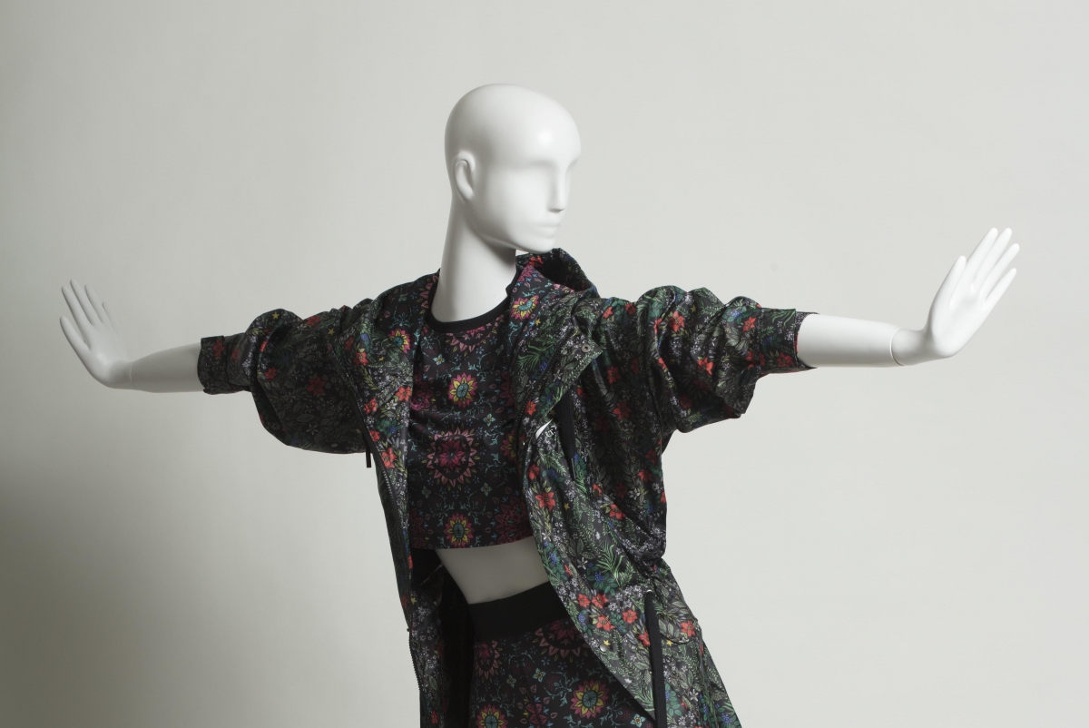 Nike floral patterned athleisure ensemble on mannequin with outstreched arms
